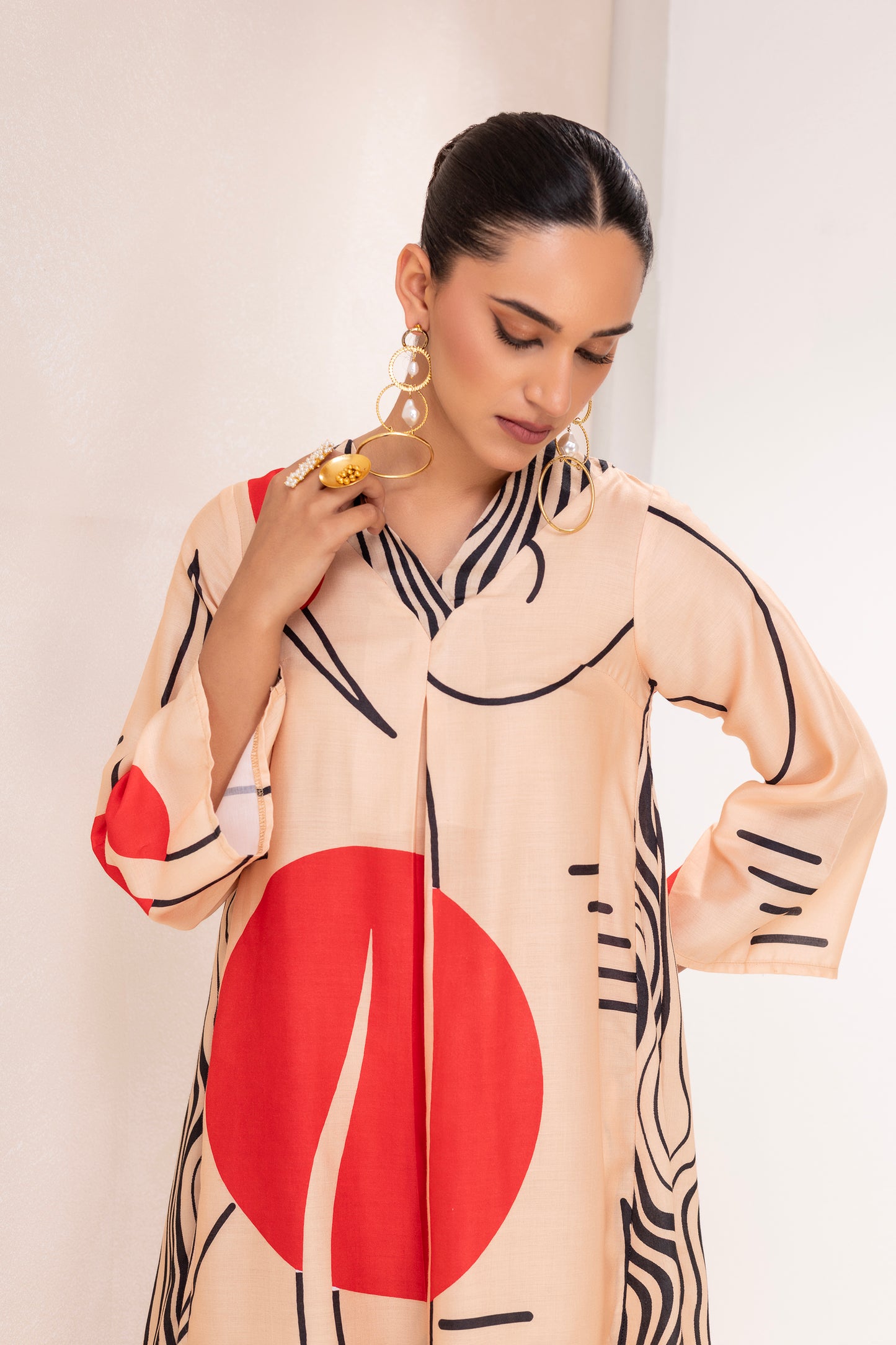BEIGE AND RED ABSTRACT PRINT KURTA SET